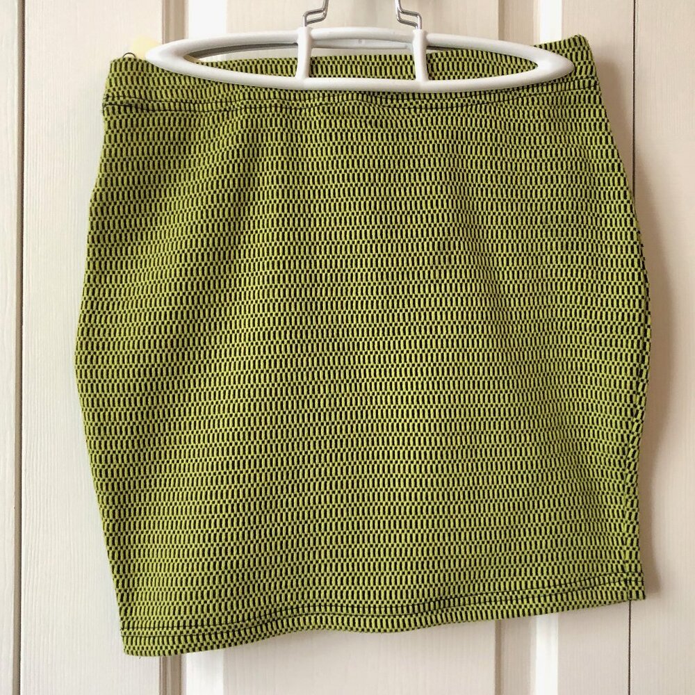 Lime green and black mini skirt with geometric pattern